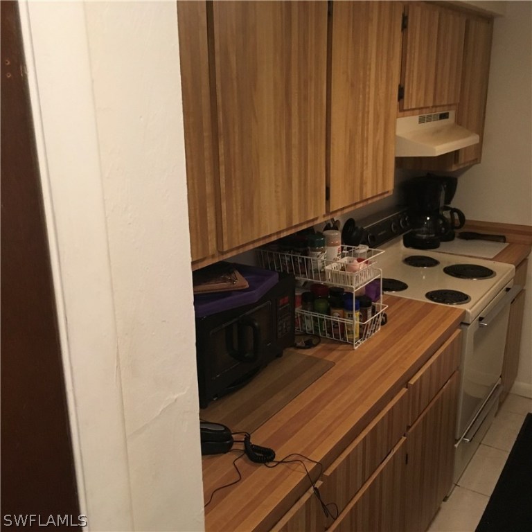 7449 Pebble Beach Road Fort Myers, FL 33967 - Photo 13 of 21 a kitchen with a sink cabinets and appliances