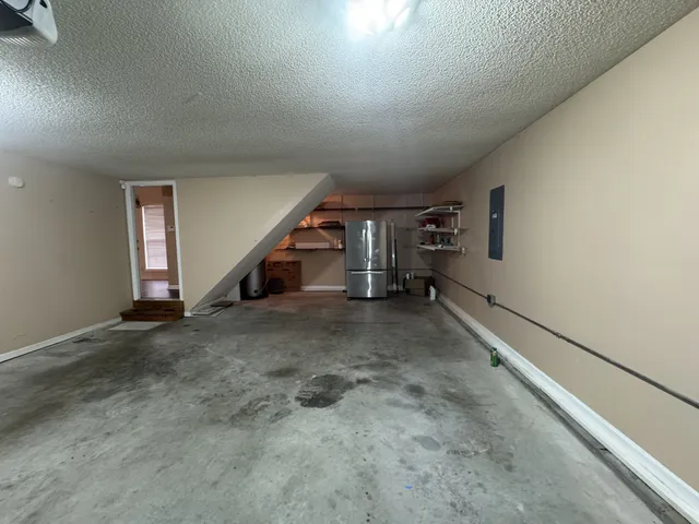 a view of a livingroom with stairs