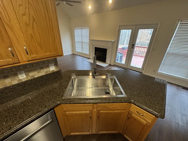 a stove top oven sitting inside of a kitchen