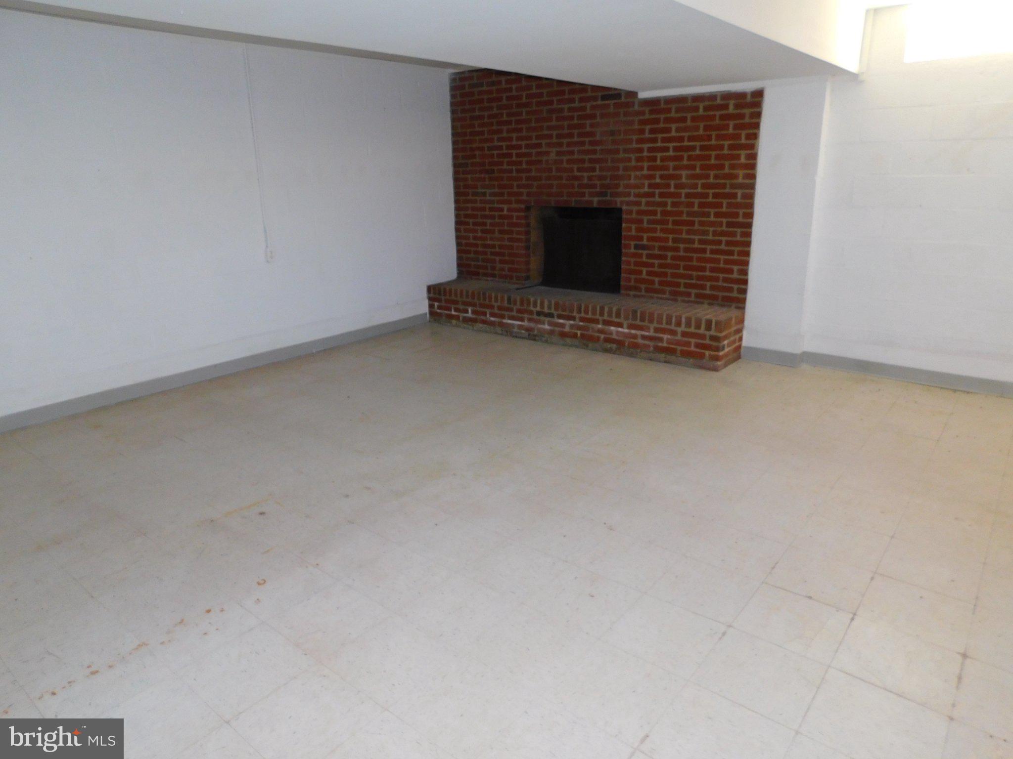 10374 Rectory Lane King George, VA 22485 - Photo 10 of 18 Basement Rec Room With Fireplace