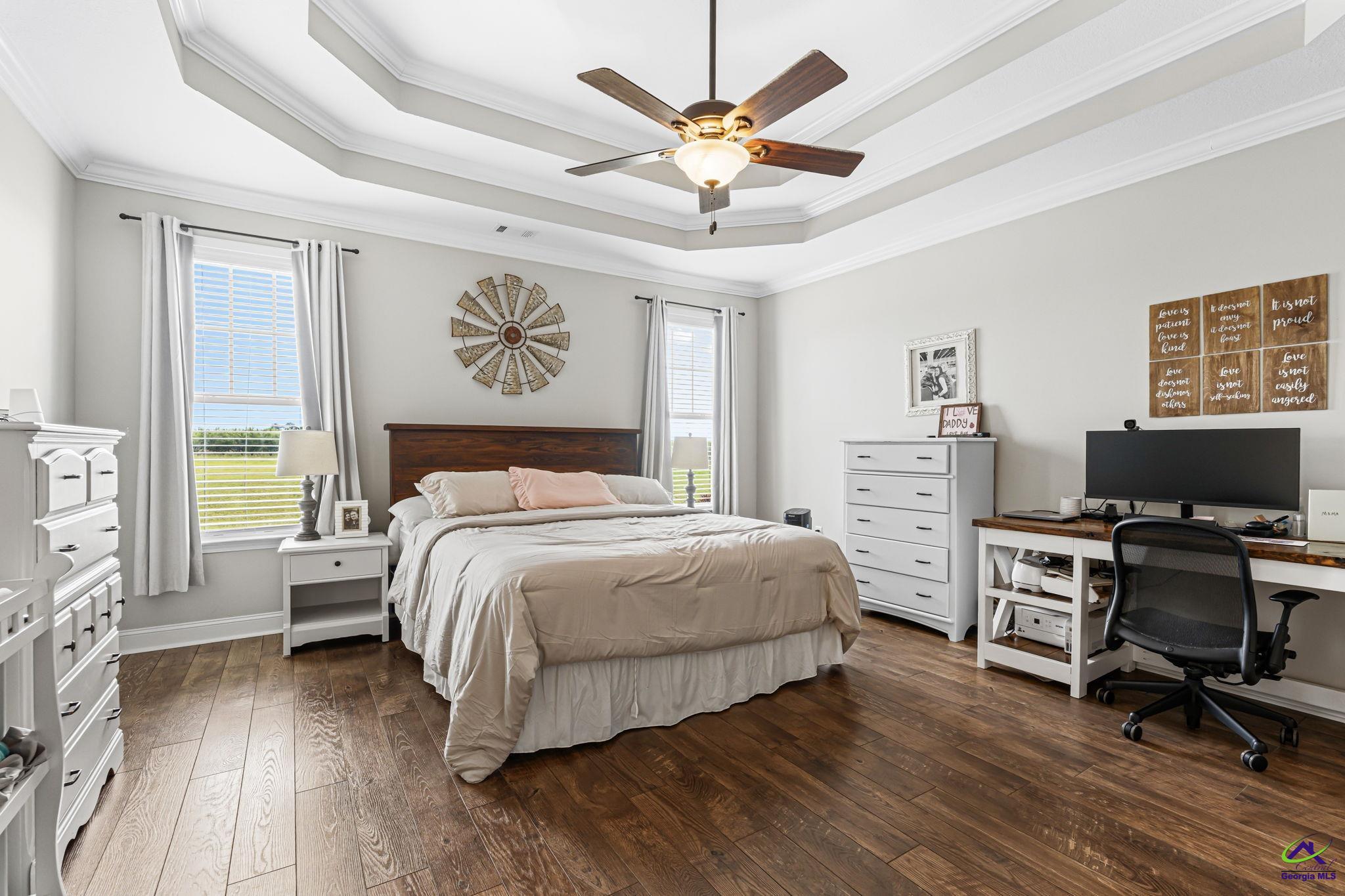 180 Woodland Trail Road Cochran, GA 31014 - Photo 12 of 25 a bedroom with a bed and a desk