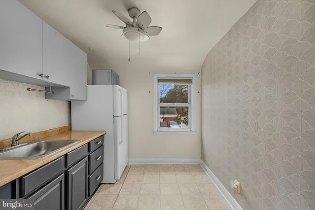 a kitchen with stainless steel appliances a refrigerator and a stove