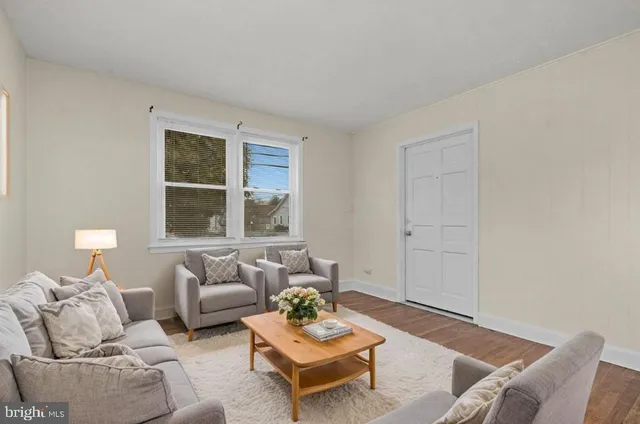 a living room with furniture and window