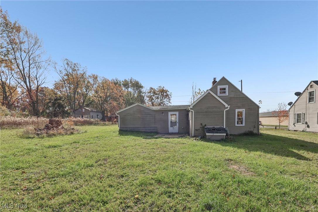 1733 Ronald Road Akron, OH 44312 - Photo 29 of 33 Back of property with a lawn