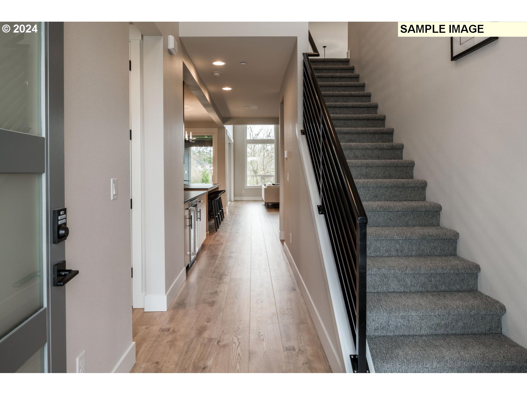 1120 South 48th Place Ridgefield, WA 98642 - Photo 3 of 25 a view of a hallway with wooden floor and stairs