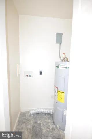 a view of a bathroom with sink and mirror