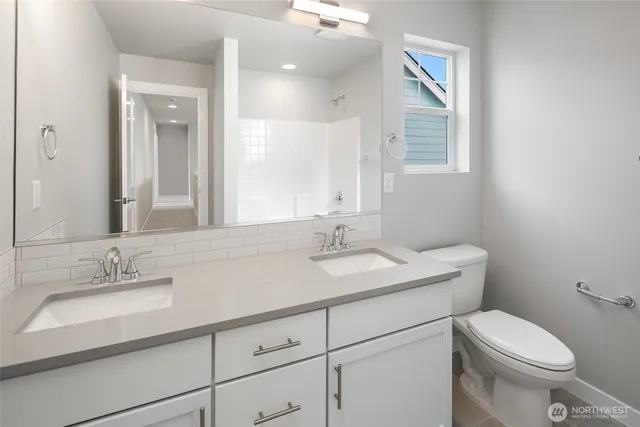 a bathroom with a sink a vanity and a mirror