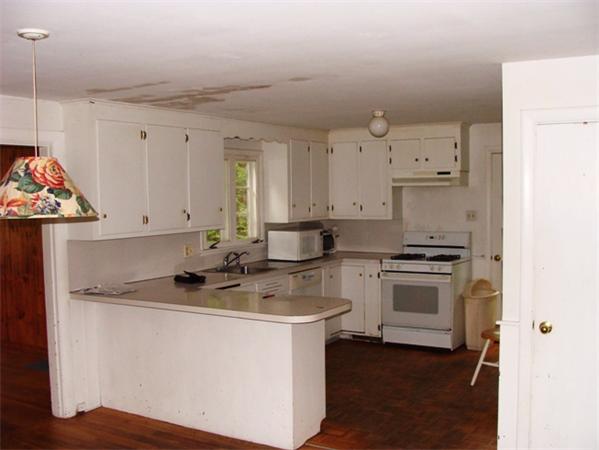 39 Bancroft Road Andover, MA 01810 - Photo 3 of 13 a kitchen that has a sink and a stove