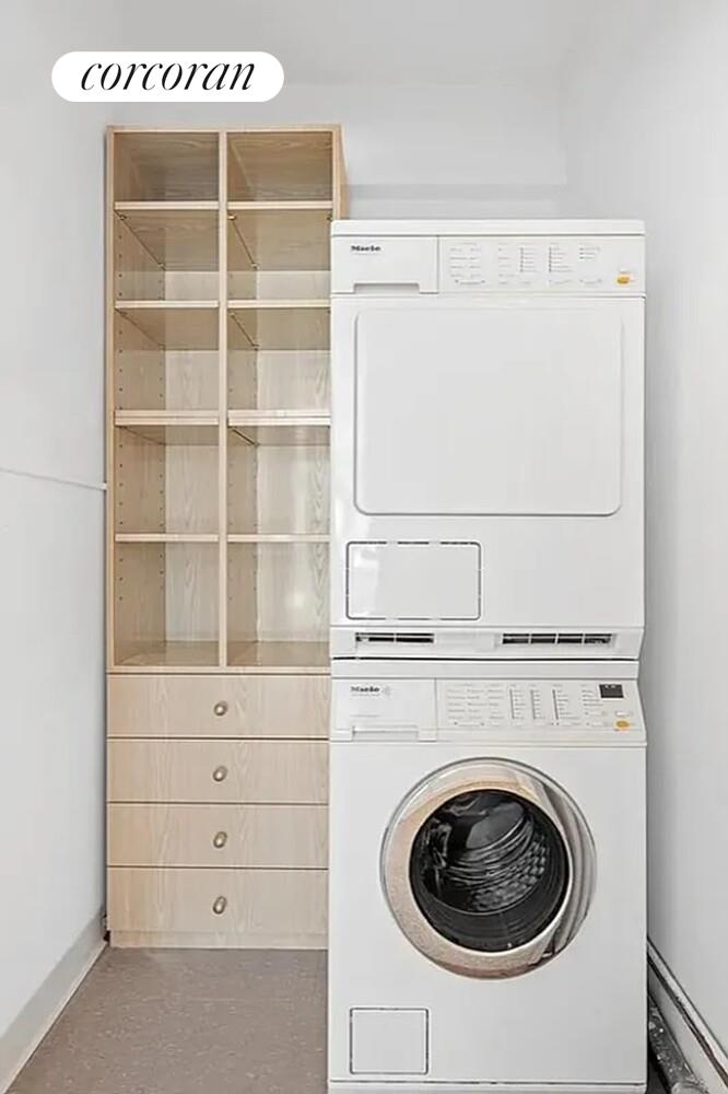 40 East 78th Street, Unit 10B Manhattan, NY 10075 - Photo 5 of 9 a utility room with dryer and washer