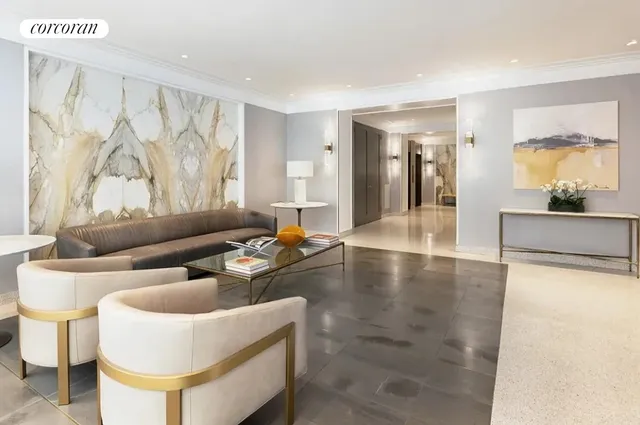 a lobby with furniture and large window