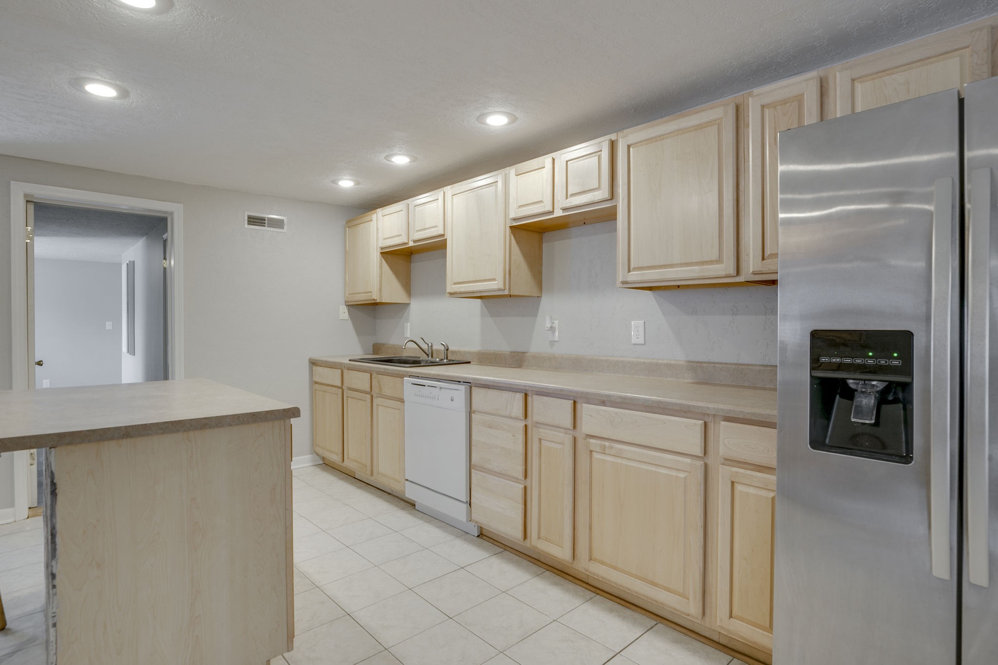 335 Eva Harbor Road Eva, TN 38333 - Photo 13 of 32 a kitchen with stainless steel appliances granite countertop a refrigerator and a sink