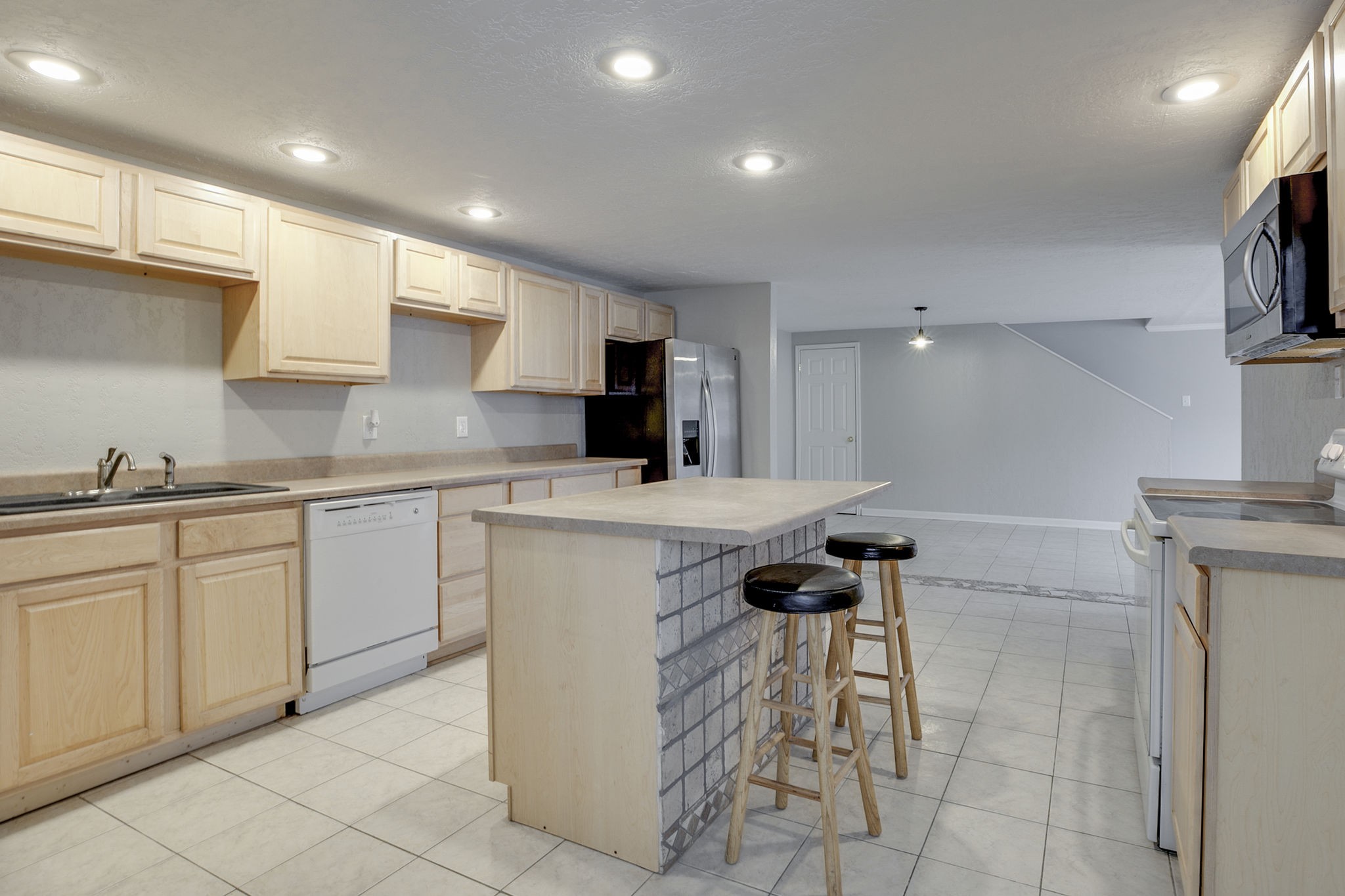 335 Eva Harbor Road Eva, TN 38333 - Photo 14 of 32 a kitchen with a sink and cabinets