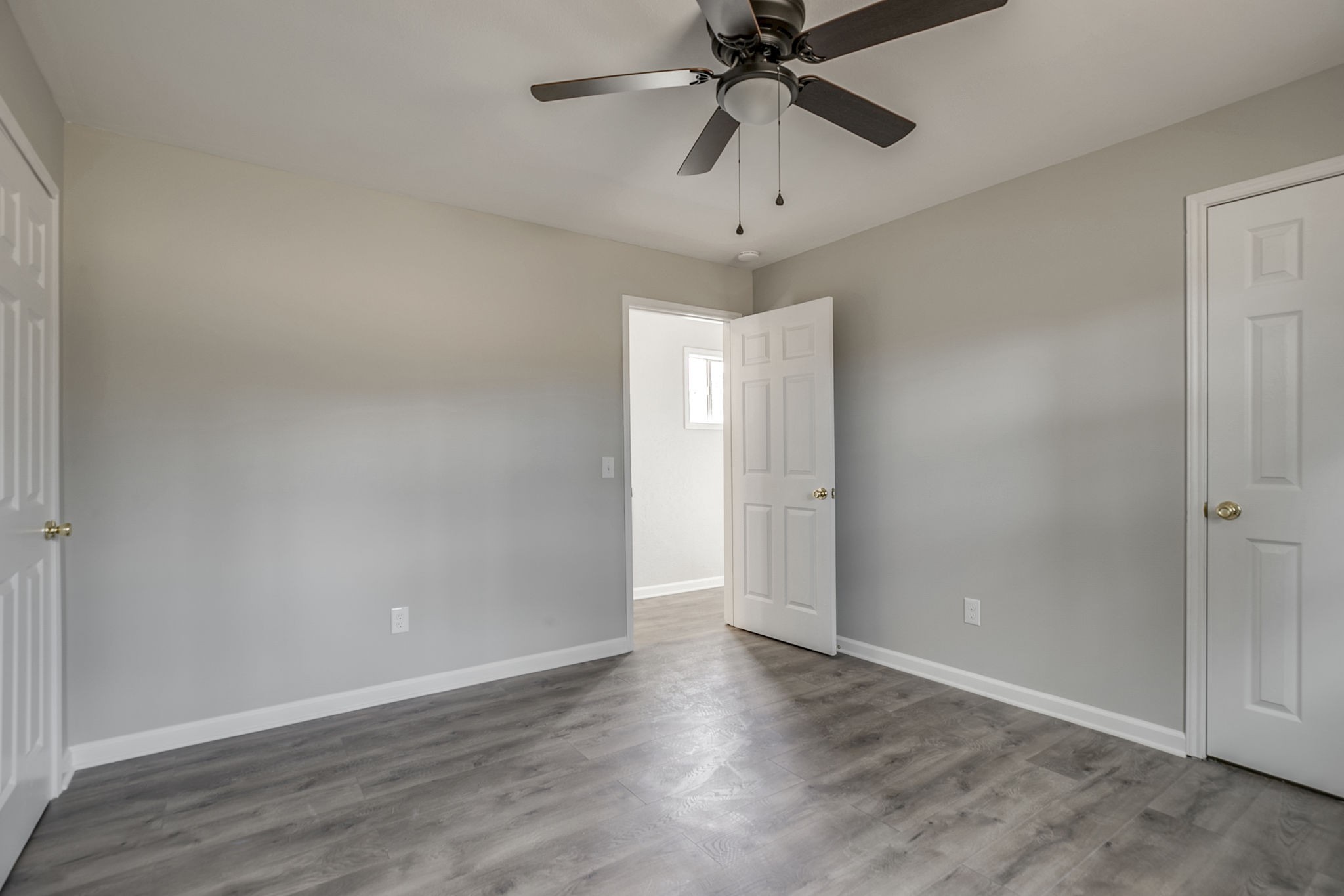 335 Eva Harbor Road Eva, TN 38333 - Photo 24 of 32 an empty room with wooden floor and fan