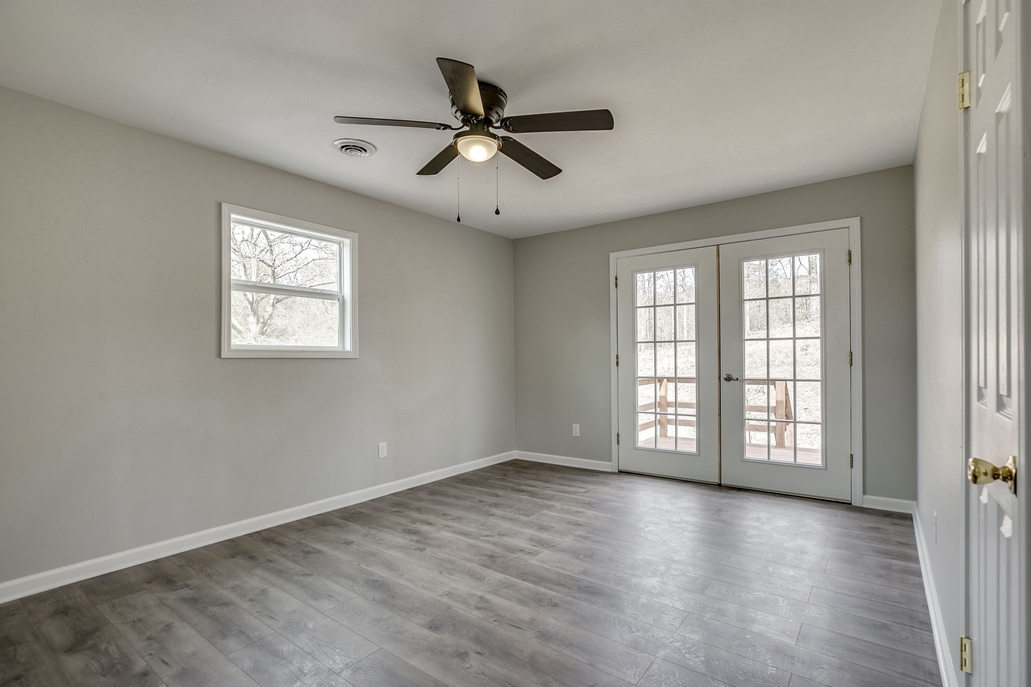 335 Eva Harbor Road Eva, TN 38333 - Photo 25 of 32 a view of an empty room with wooden floor and a window