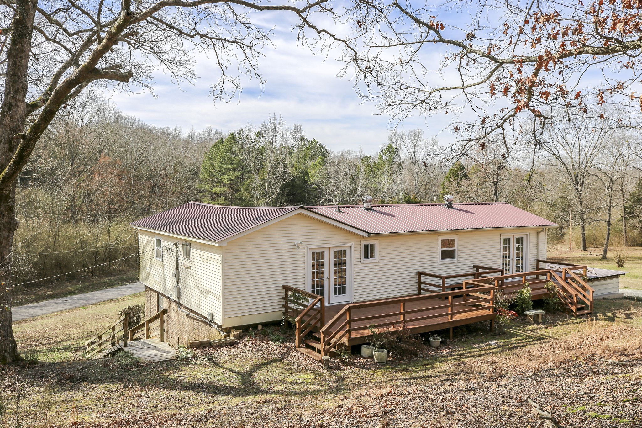 335 Eva Harbor Road Eva, TN 38333 - Photo 29 of 32 a aerial view of a house with a yard and sitting area