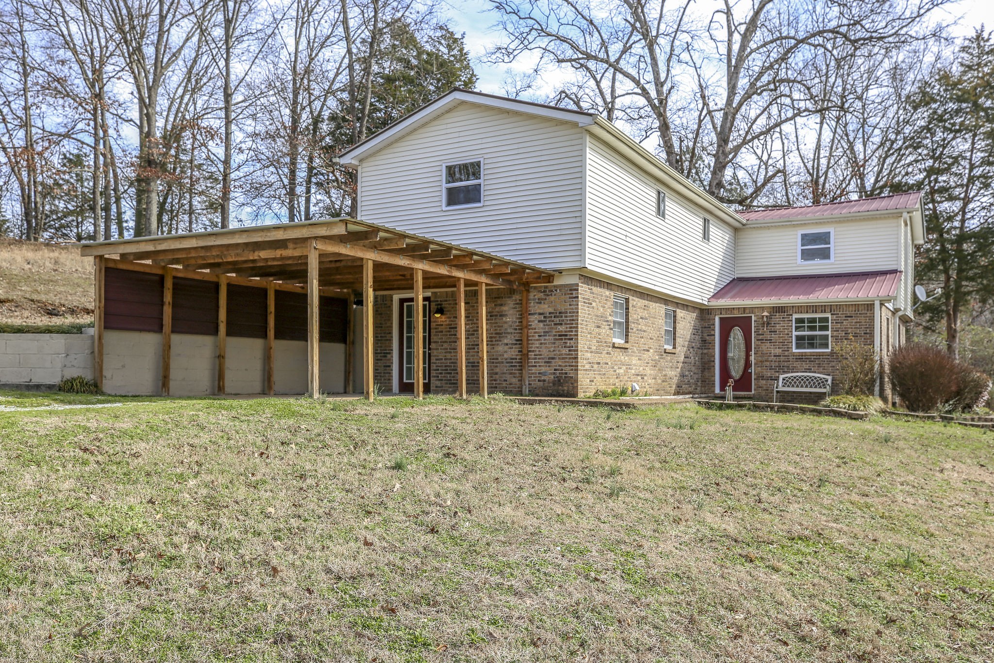 335 Eva Harbor Road Eva, TN 38333 - Photo 4 of 32 a front view of a house with a garden