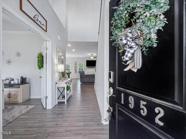 a view of living room kitchen with furniture and wooden floor