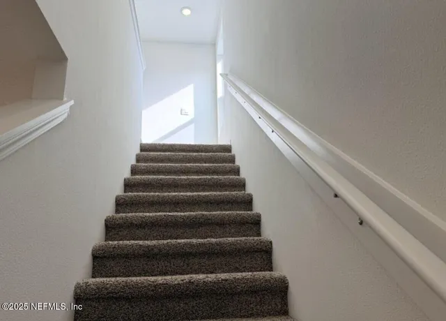 a view of an empty room and a window
