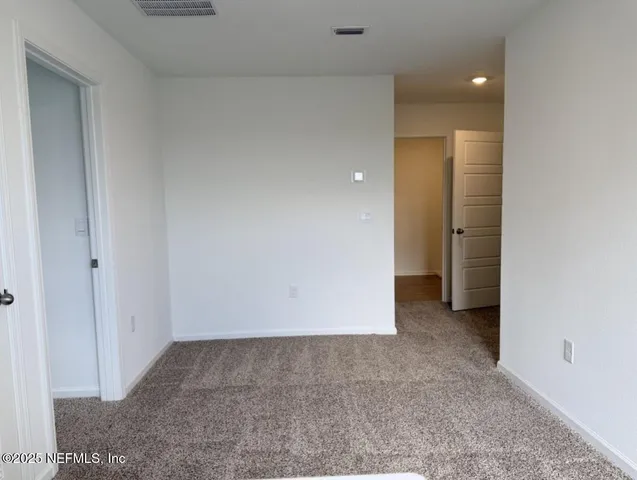 a bathroom with double sink and a mirror