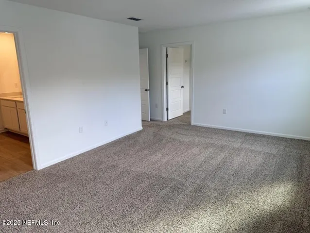 a bathroom with a granite countertop toilet a sink and a bathtub