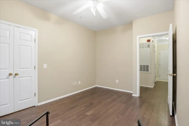 a bathroom with a granite countertop sink toilet a large mirror a shower and a bathtub