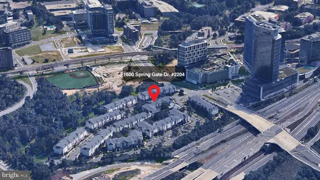 a view of multiple houses with outdoor space