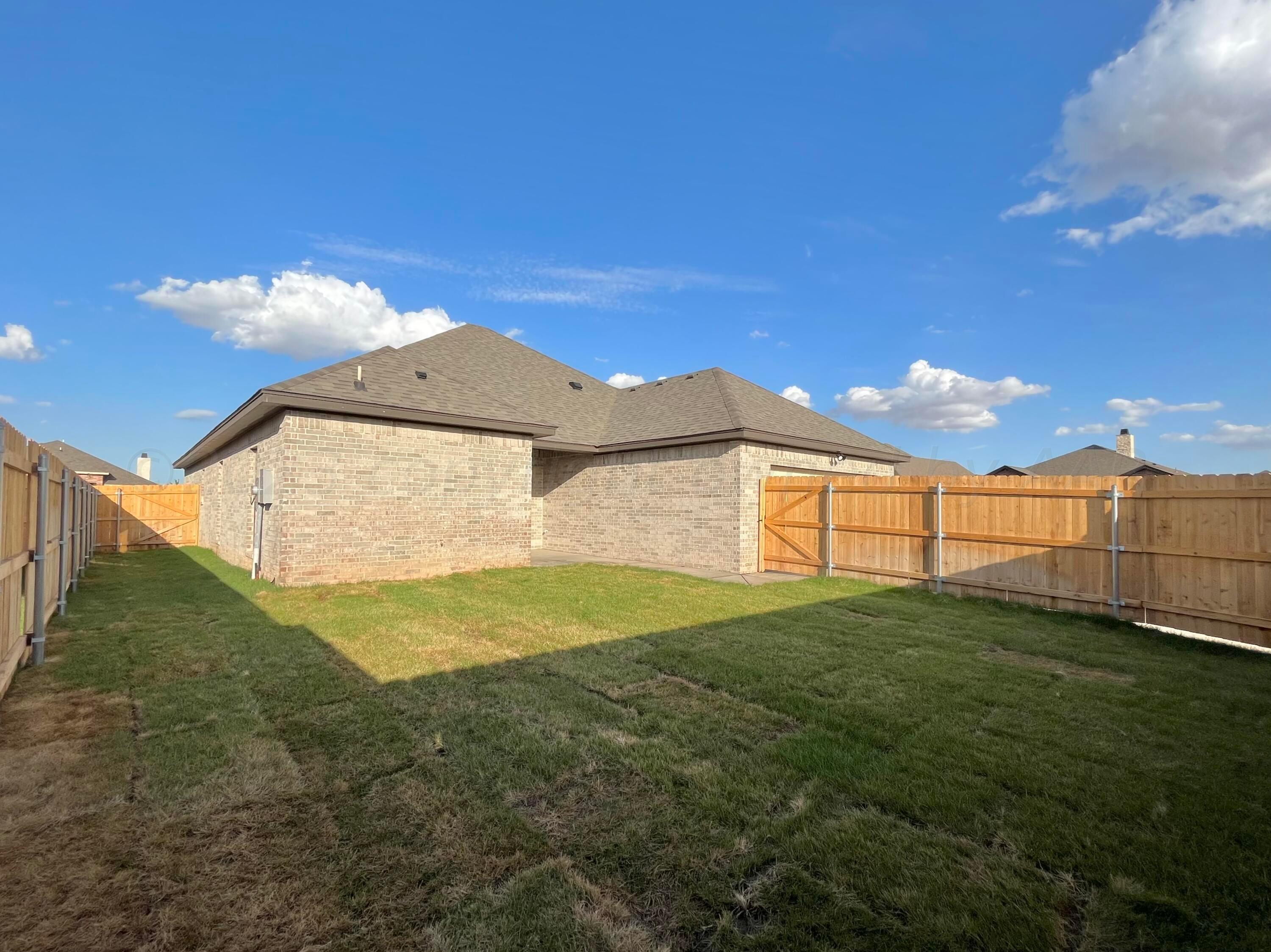 7610 Crestline Drive Amarillo, TX 79119 - Photo 9 of 9 a view of a big yard next to a house