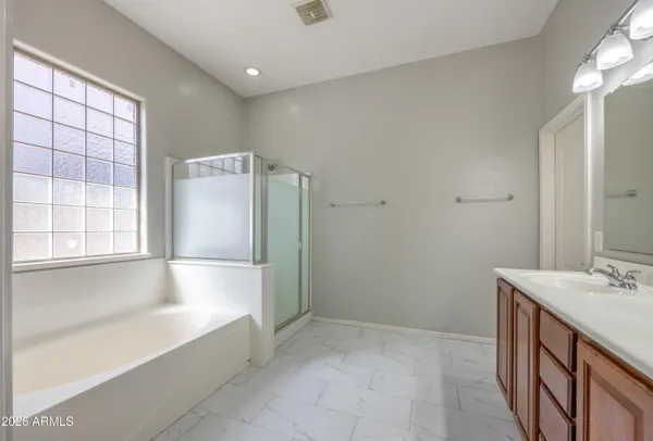 a view of a kitchen with a sink and a refrigerator