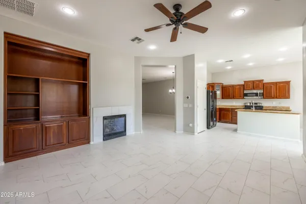 a view of a kitchen with a sink and a refrigerator