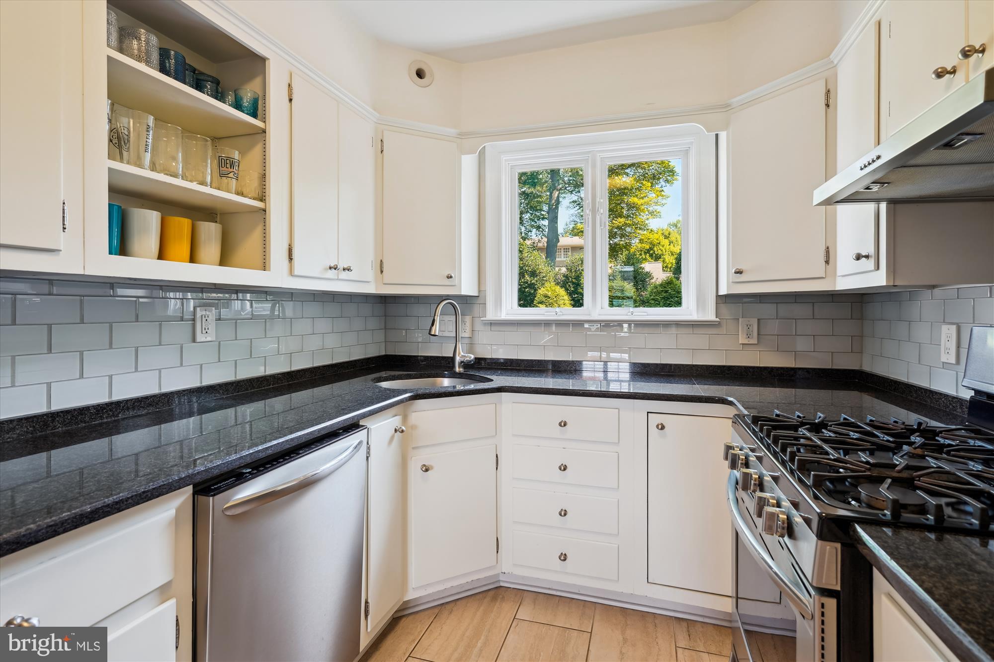 4317 Saul Road Kensington, MD 20895 - Photo 14 of 33 a kitchen with white cabinets and window