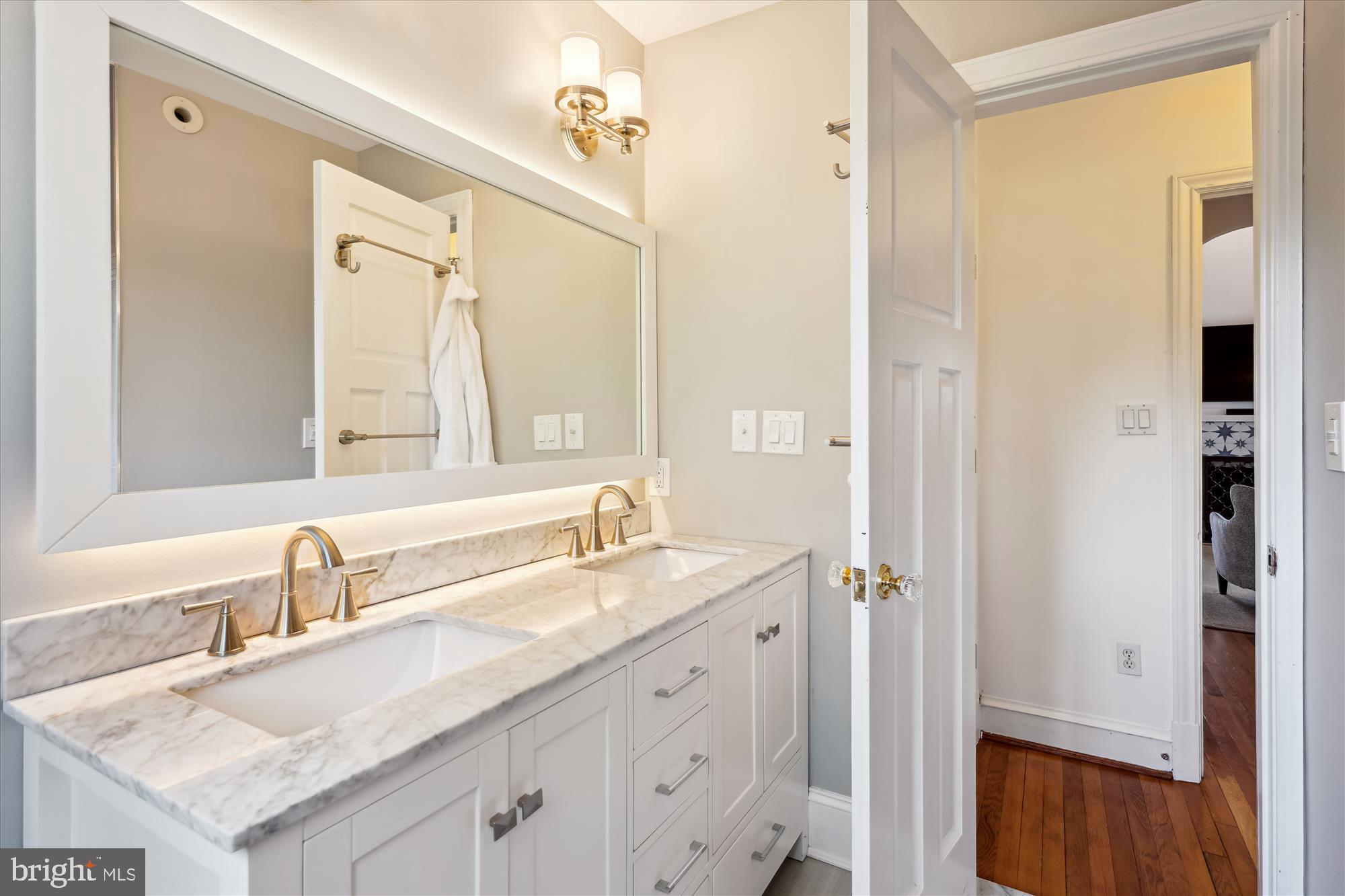 4317 Saul Road Kensington, MD 20895 - Photo 19 of 33 a bathroom with a sink double vanity and a mirror