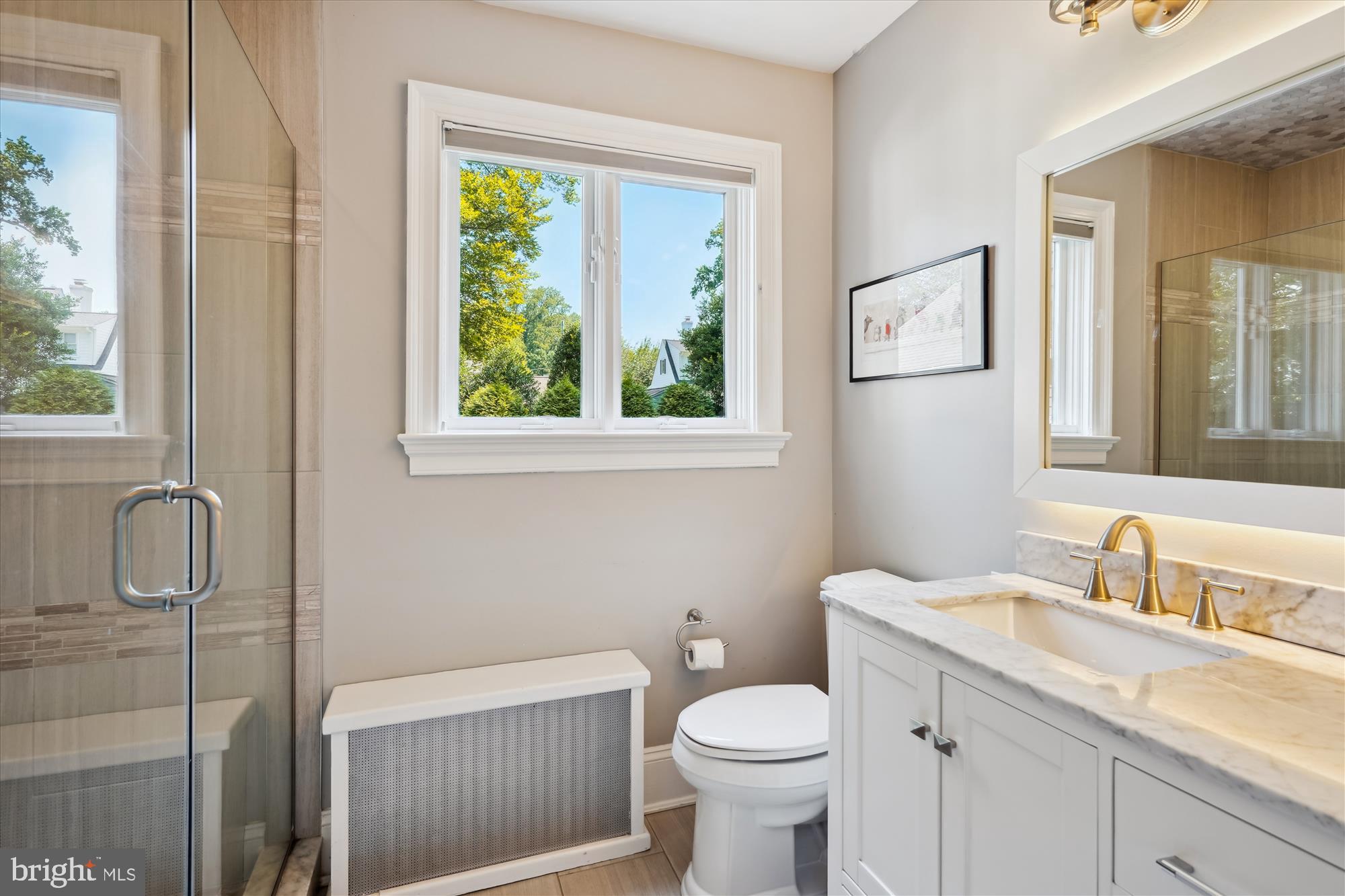 4317 Saul Road Kensington, MD 20895 - Photo 20 of 33 a bathroom with a granite countertop sink toilet and a window