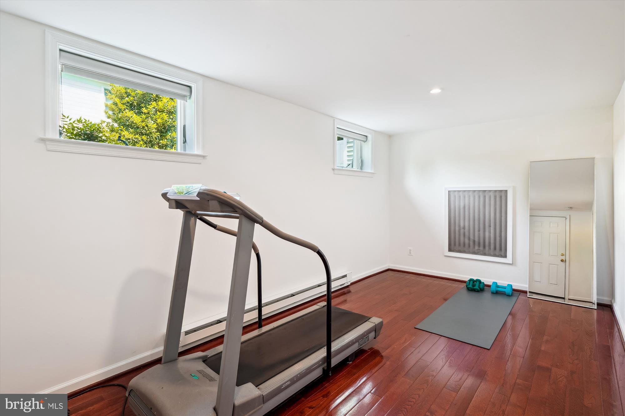 4317 Saul Road Kensington, MD 20895 - Photo 28 of 33 a view of an empty room with window wooden floor and windows