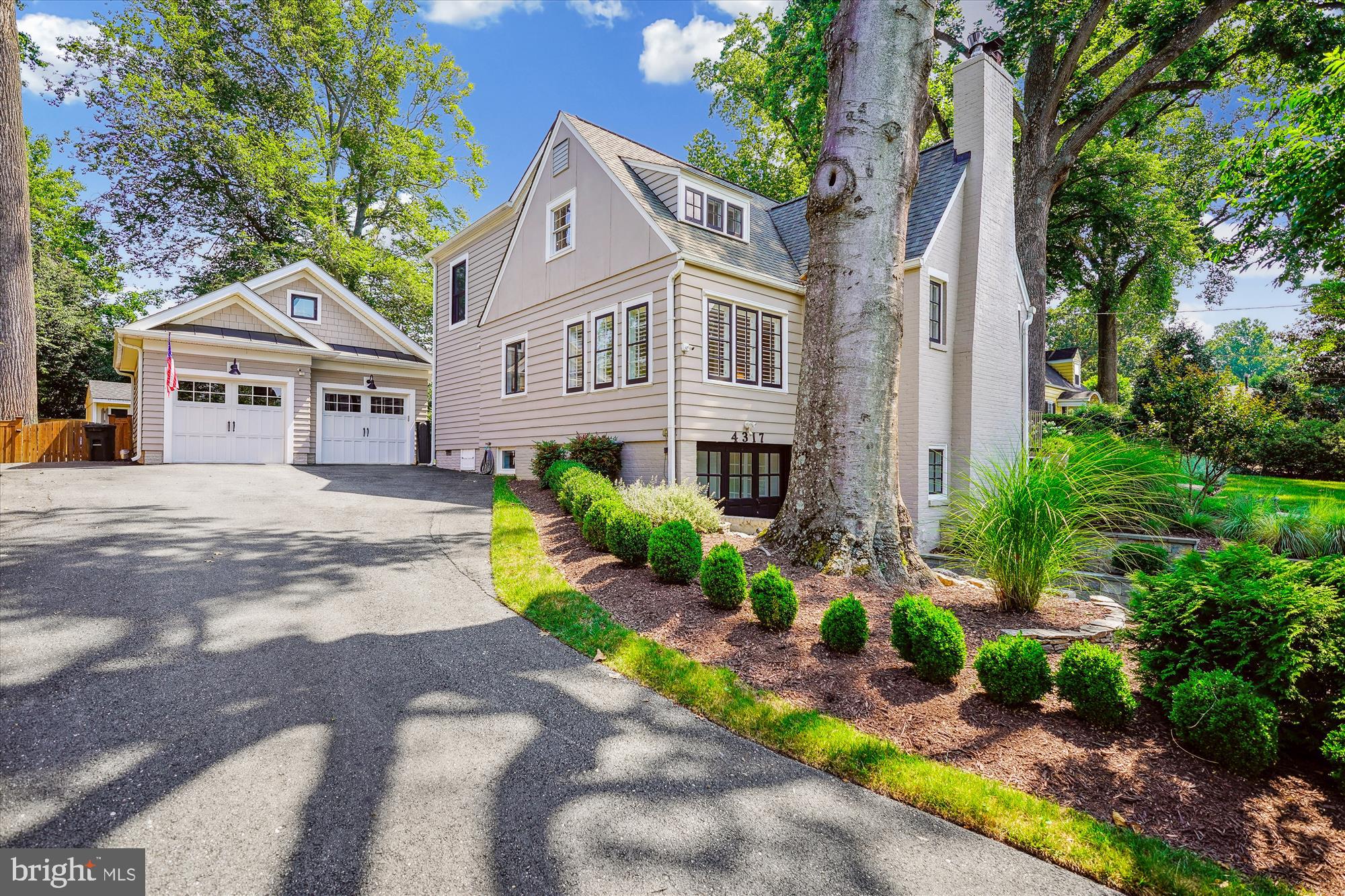 4317 Saul Road Kensington, MD 20895 - Photo 3 of 33 a front view of a house with a yard and potted plants