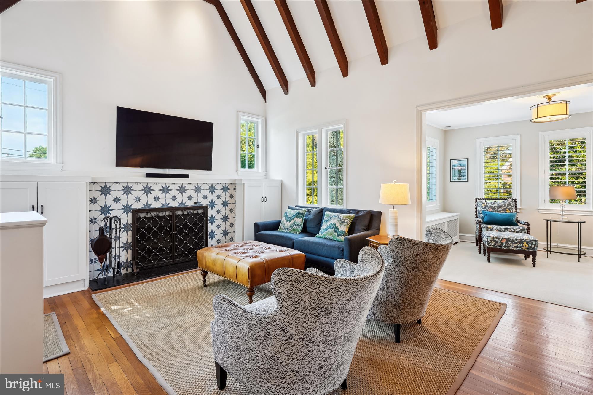 4317 Saul Road Kensington, MD 20895 - Photo 8 of 33 a living room with fireplace furniture and a flat screen tv