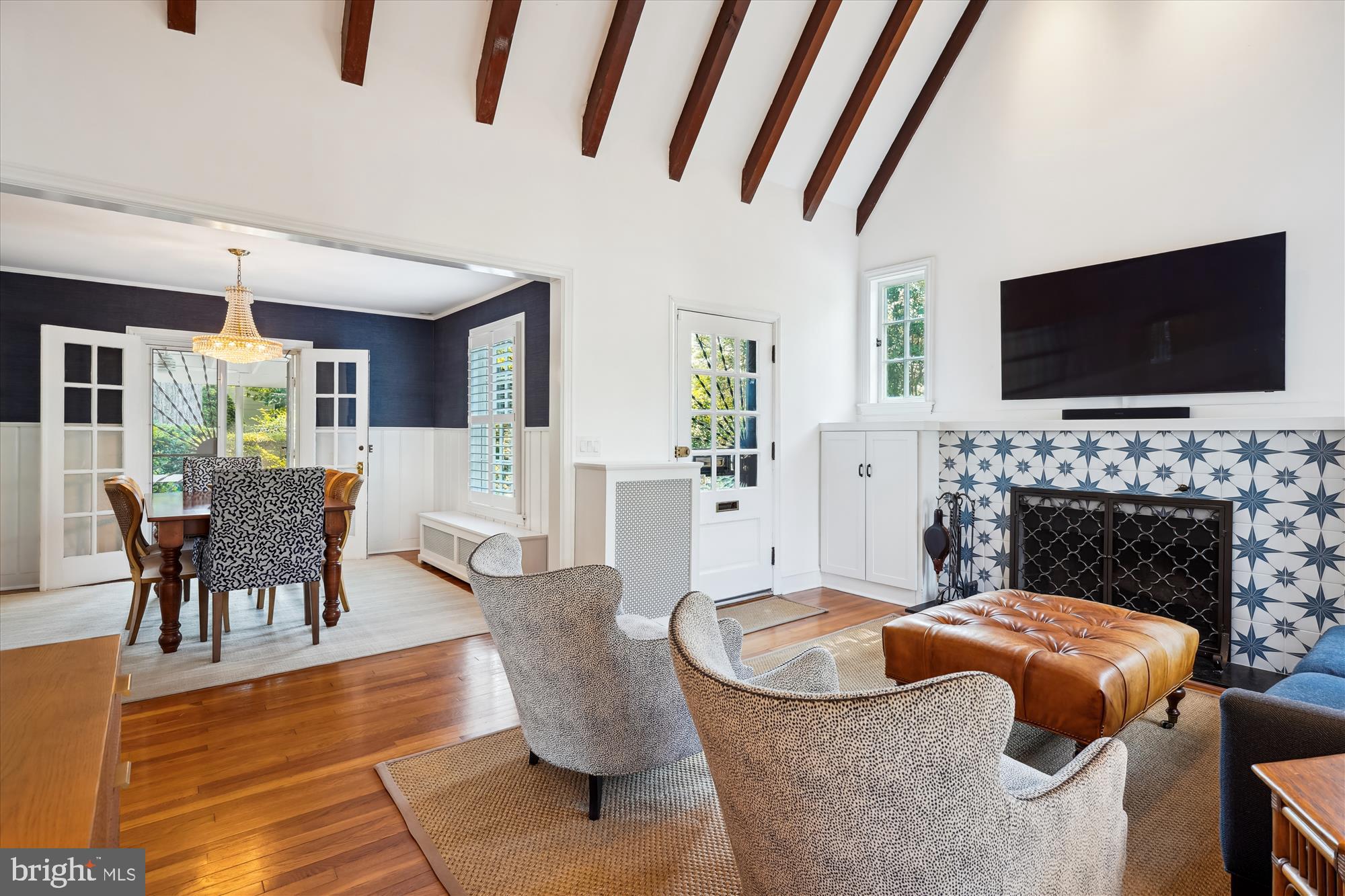 4317 Saul Road Kensington, MD 20895 - Photo 9 of 33 a living room with furniture a flat screen tv and a fireplace