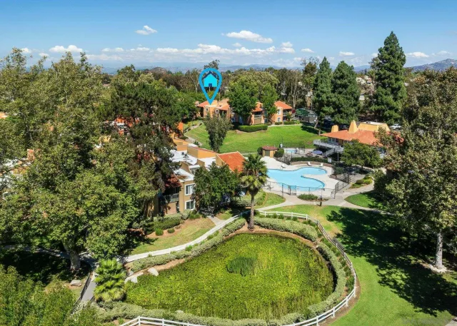 a view of a swimming pool with a yard