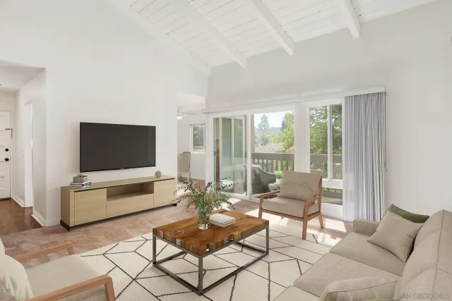 a view of a balcony with wooden floor