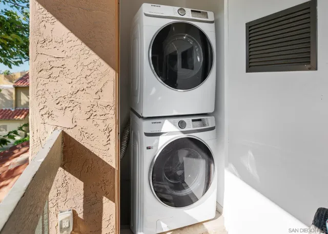 an empty room with wooden floor and a window