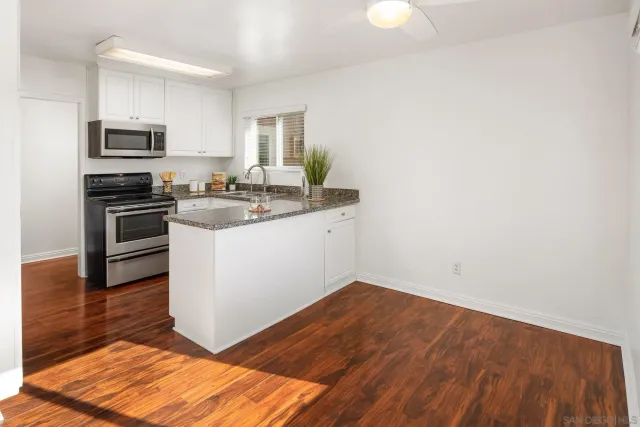 a kitchen with sink and window