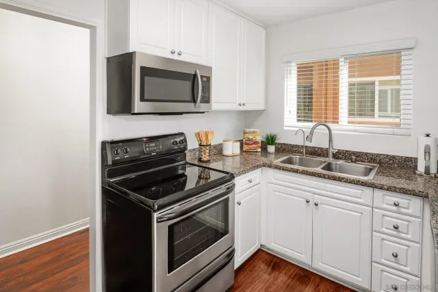 a view of a bathroom with a shower and a sink
