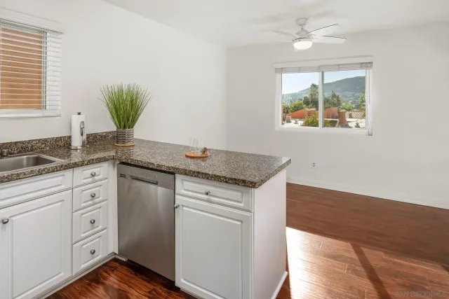 a bathroom with a shower curtain and a toilet