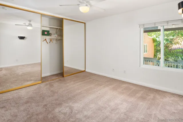 a bathroom with a granite countertop toilet a sink and a bathtub