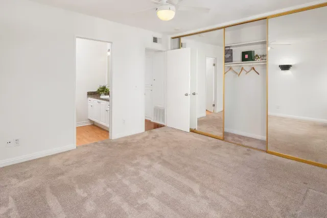 a view of a house with backyard sitting area and garden