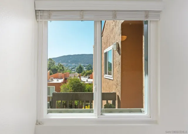 a view of a house with swimming pool and a small yard