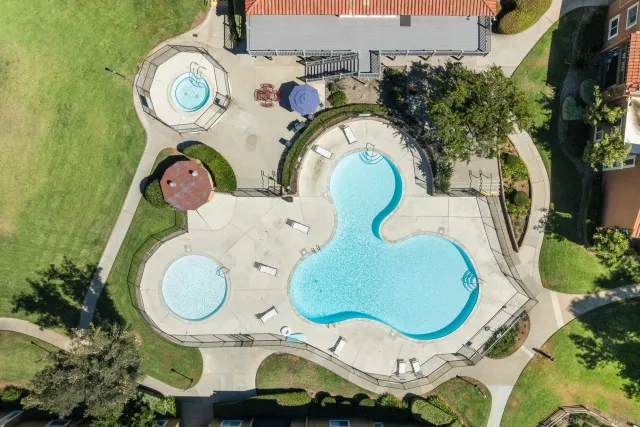 an aerial view of residential houses with outdoor space