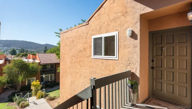 a view of an empty room with a balcony