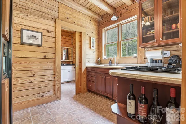 a kitchen with a sink and a stove