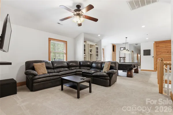 a dining room with a table and chairs