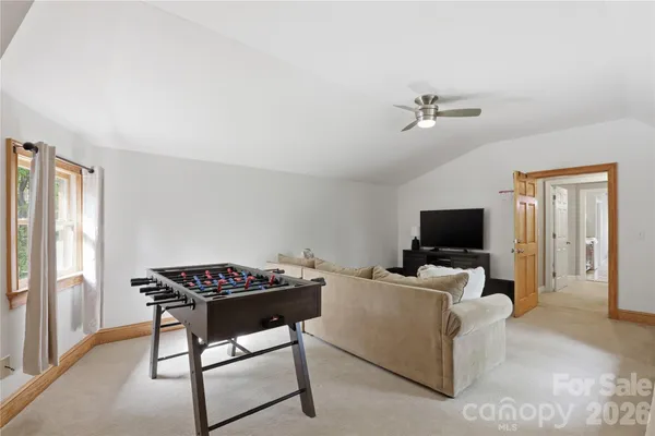 a view of a livingroom with furniture and a fireplace